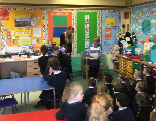 Primary 1A and 1B pupils with Eimear McEleney (student teacher) and Pauline Jordan (school caretaker) from Good Shepherd Primary School, Derry