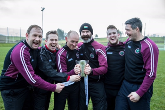 The successful St Mary's team management with the Sigerson Cup, first won by University College Cork in 1911.