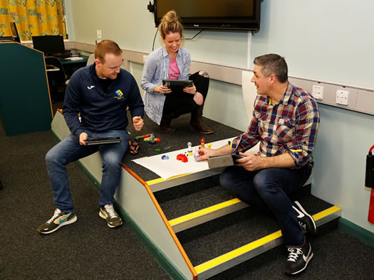 Lecturer Conall ó Máirtín exploring with his students how to use digital technology to enhance learning.