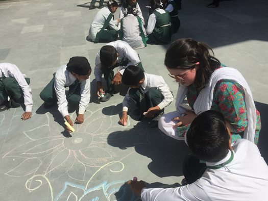 St Mary's student Corrie Murray enjoying some Art time with the children at Sneha Doon Academy