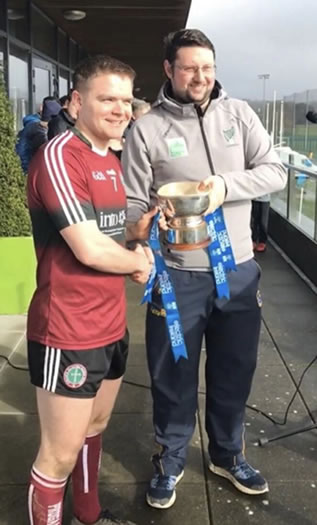 Team captain, Paul Gunning, accepting the Fergal Maher Cup