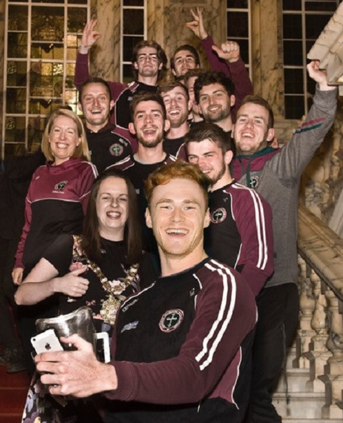 St Mary's Gaelic football and netball Team members celebrate at City Hall reception