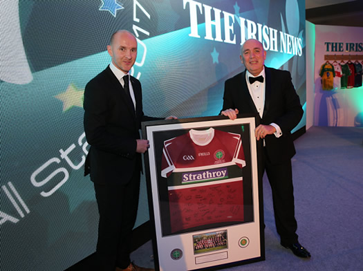 Paddy Tally receives a framed jersey from Kieran Kennedy, CEO for O'Neill's International Sportswear during the Irish News All-Stars at Armagh City Hotel